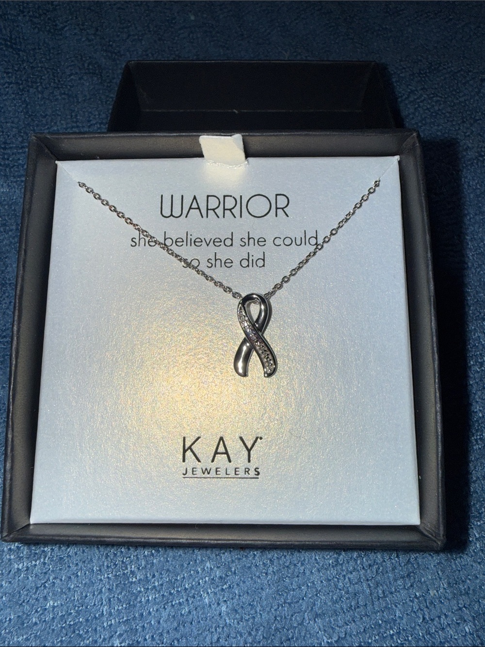 KAY Jewelers silver ribbon pendant necklace with sparkling accents